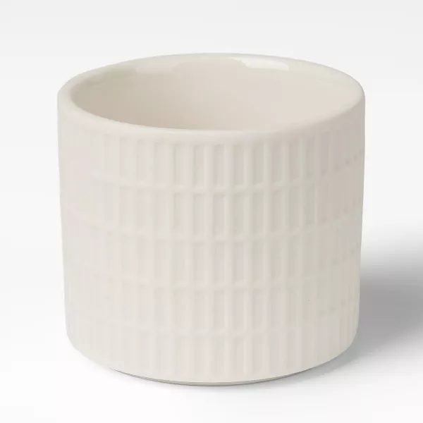 Mælkehvide gittermønstrede keramiske lysestager Mælkehvide gittermønstrede keramiske lysestager